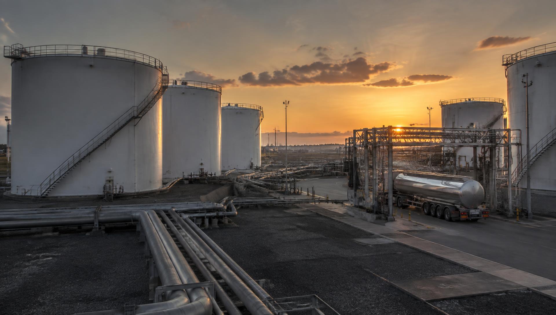 Petroleum storage tanks and a fuel tanker at a modern depot